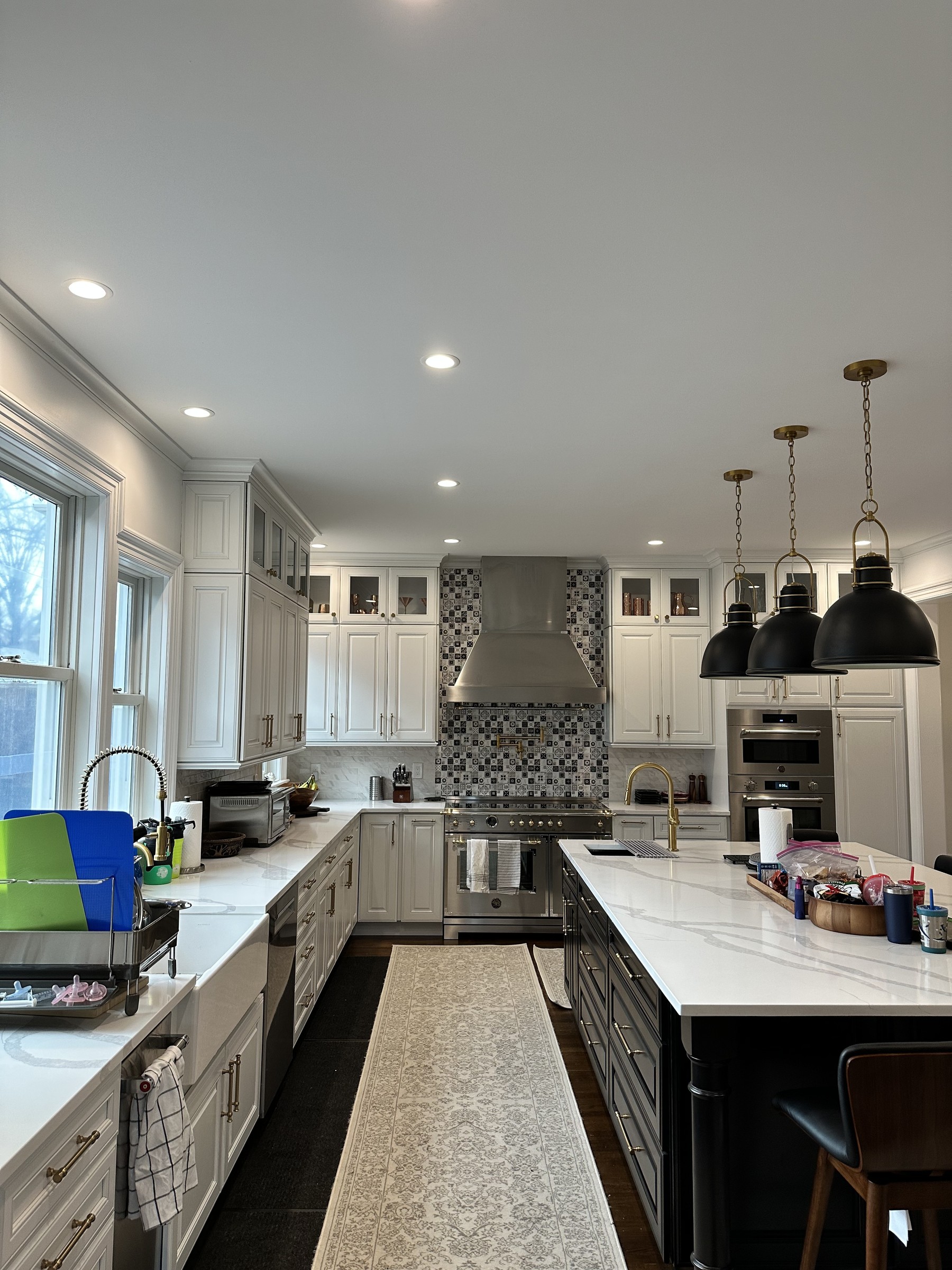 Estate White kitchen by DezzWorks — Range Wall · Installed